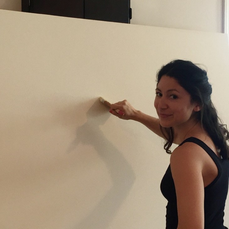 Courtney Bae painting in the studio.