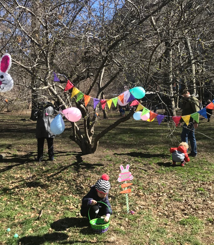 Children at Easter egg hunt in Manhattan, New York with Easter Bunny