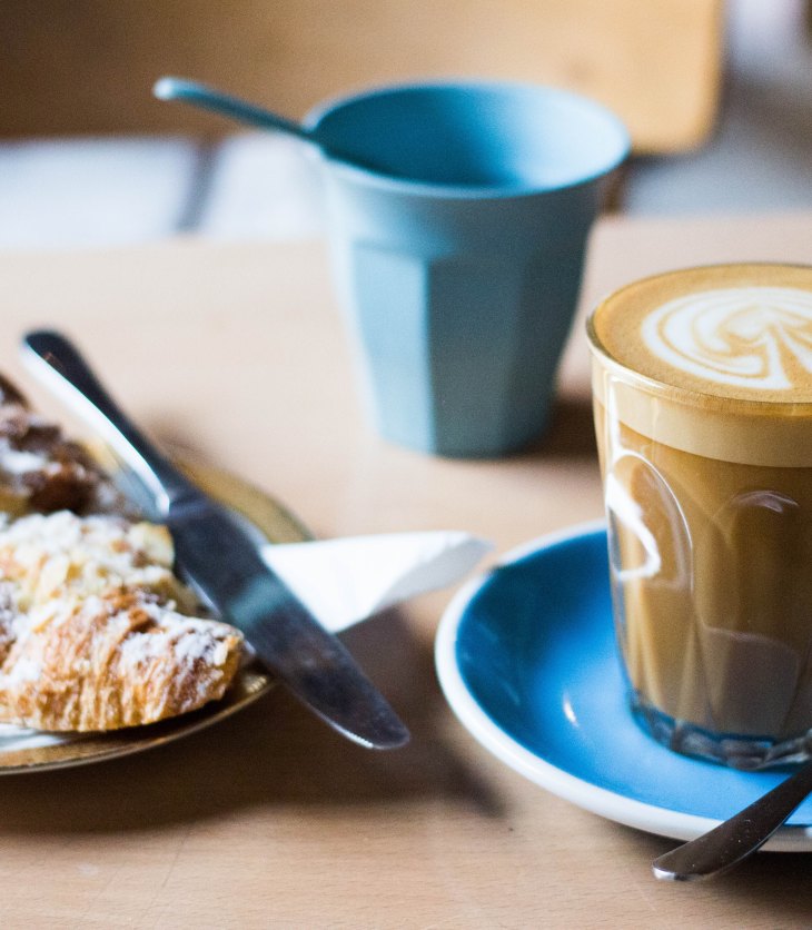 latte coffee and croissant at coffee shop