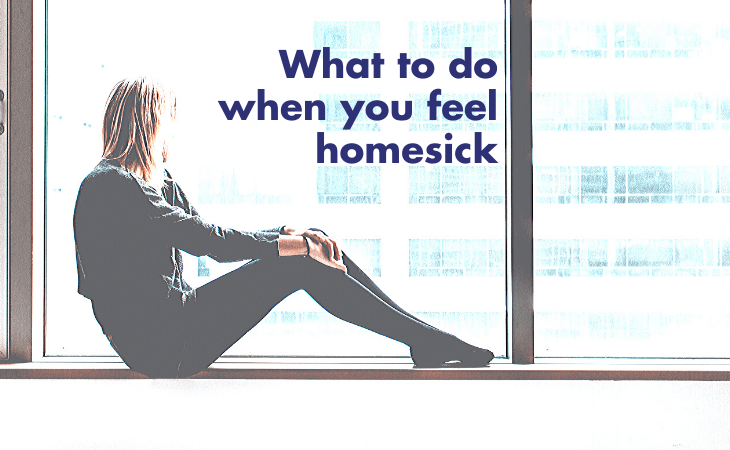 lonely woman sitting by window looking out