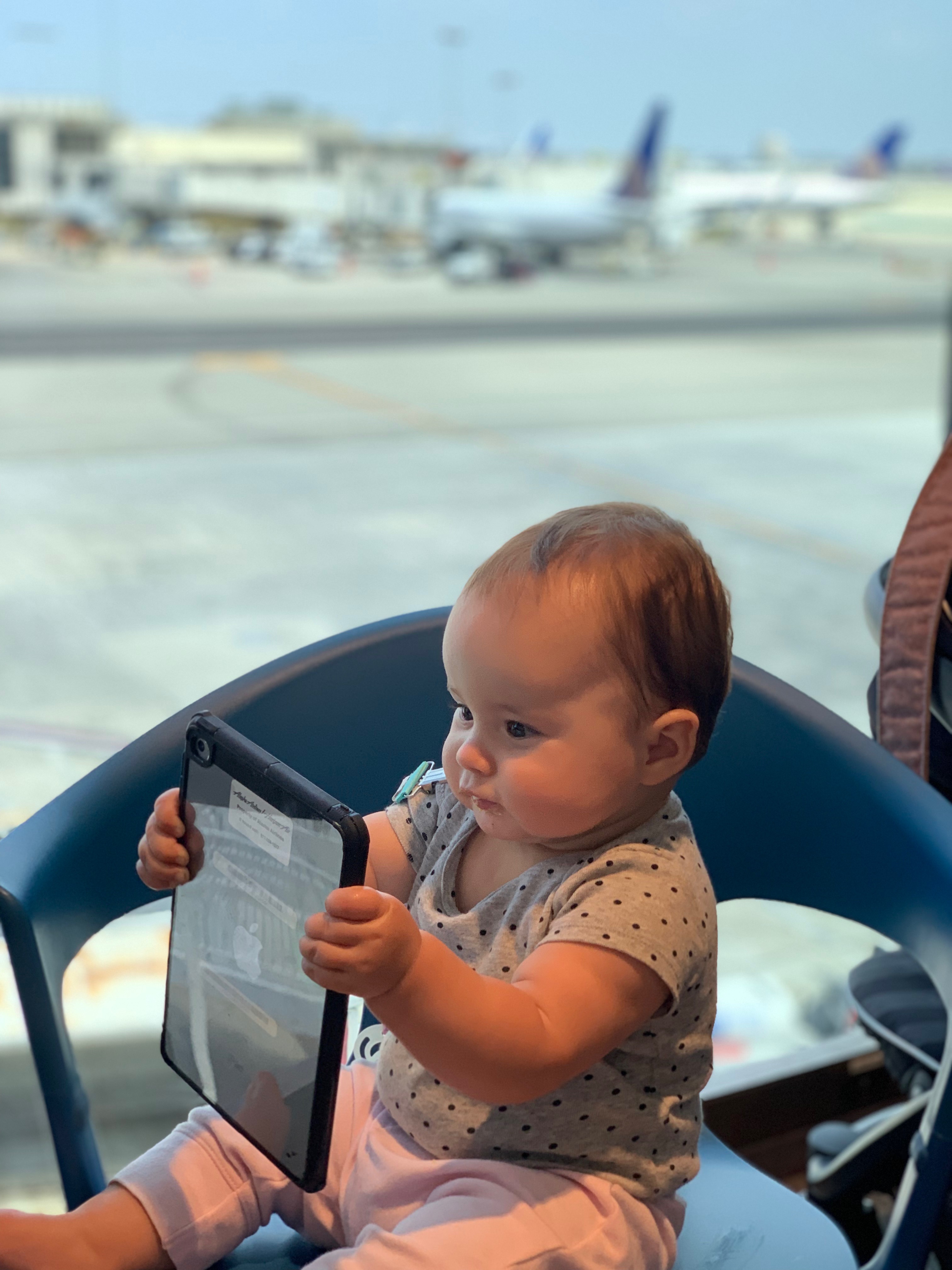 baby at airport lounge waiting for flight to depart