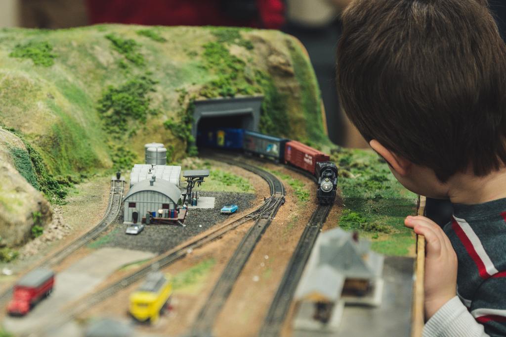Child playing with train set